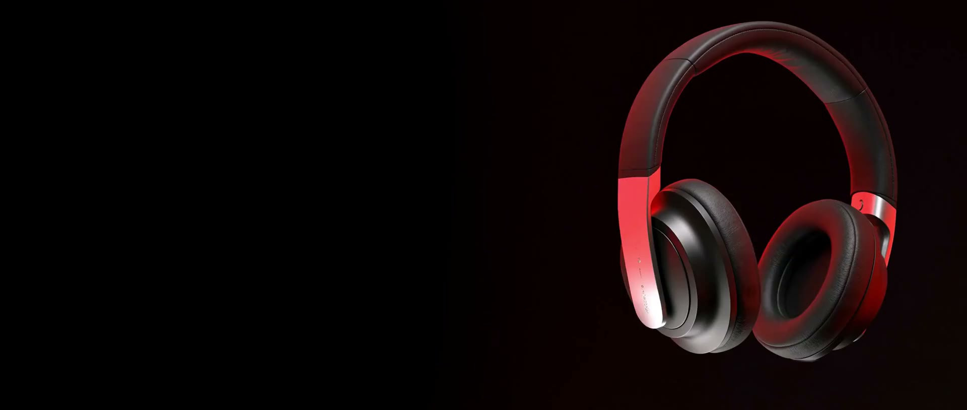 Unos auriculares rojos y negros girando sobre un fondo oscuro